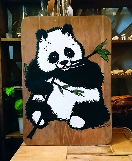 Peinture panda sur plaque de bois